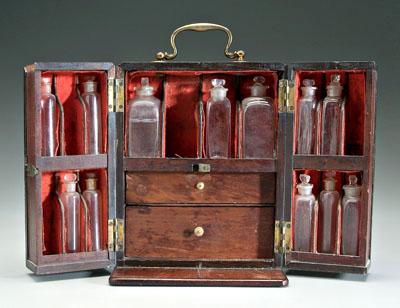 Appraisal: Mahogany traveling apothecary two side opening doors brass mounts interior