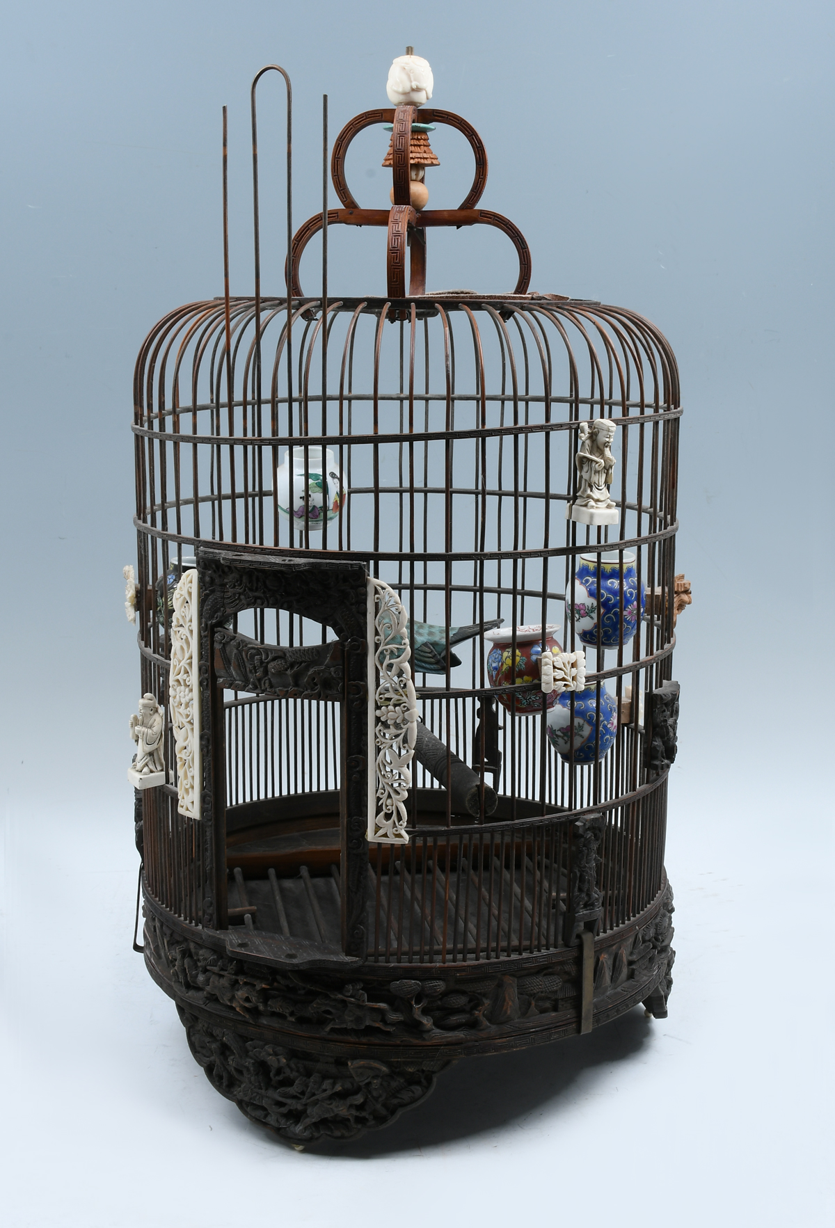 Appraisal: INCREDIBLY CARVED LATE QING BAMBOO BIRDCAGE Tall Chinese bird cage