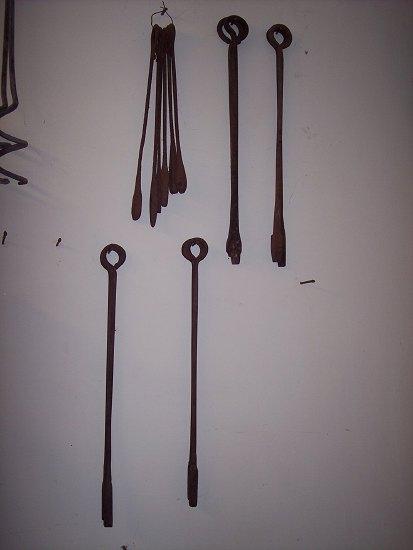 Appraisal: A large quantity of wrought iron branding irons with loop