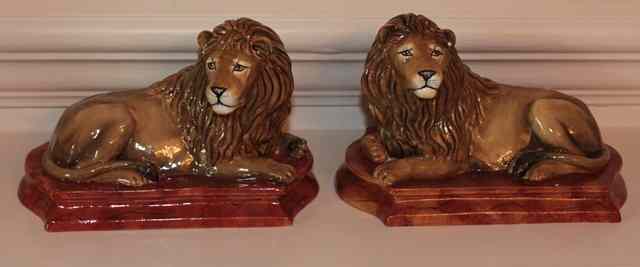 Appraisal: A PAIR OF HALCYON DAYS PORCELAIN FIGURES of recumbent lions