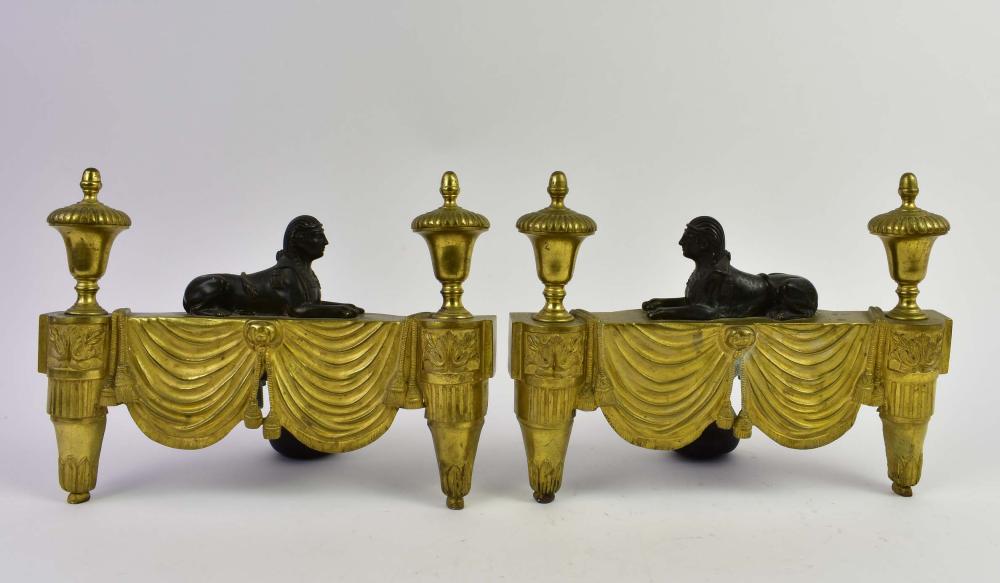 Appraisal: PAIR OF EMPIRE PATINATED AND GILT BRONZE CHENETSEarly th Century