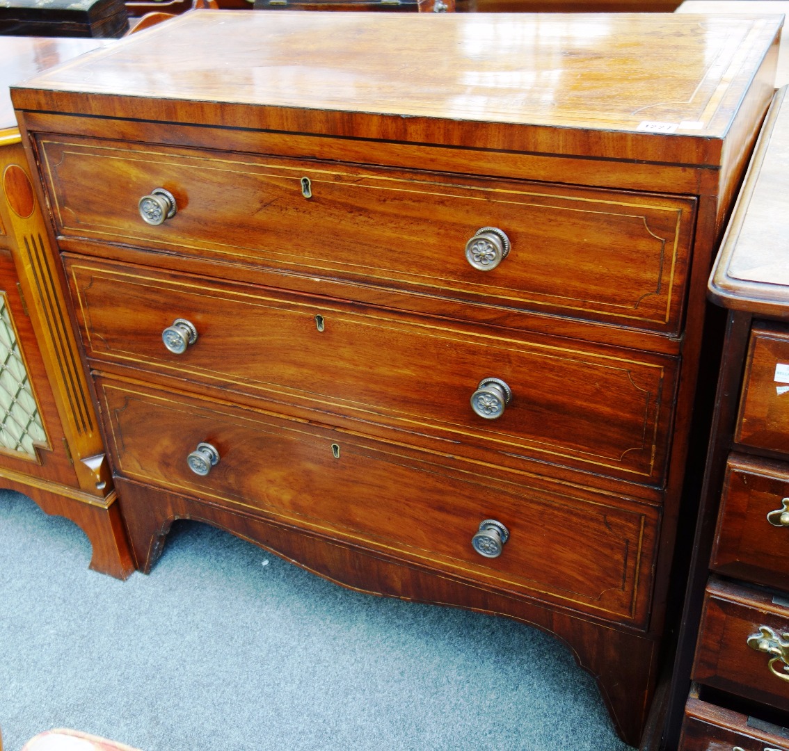 Appraisal: A th century inlaid mahogany chest of three long graduated