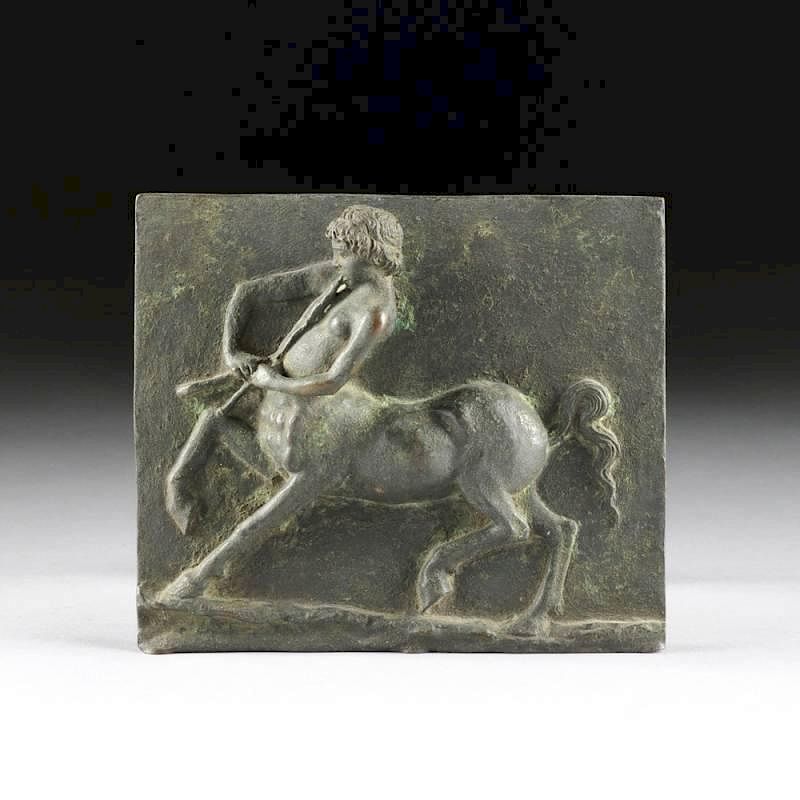 Appraisal: A CONTINENTAL PATINATED BRONZE PLAQUE OF A CENTAUR YOUTH PLAYING