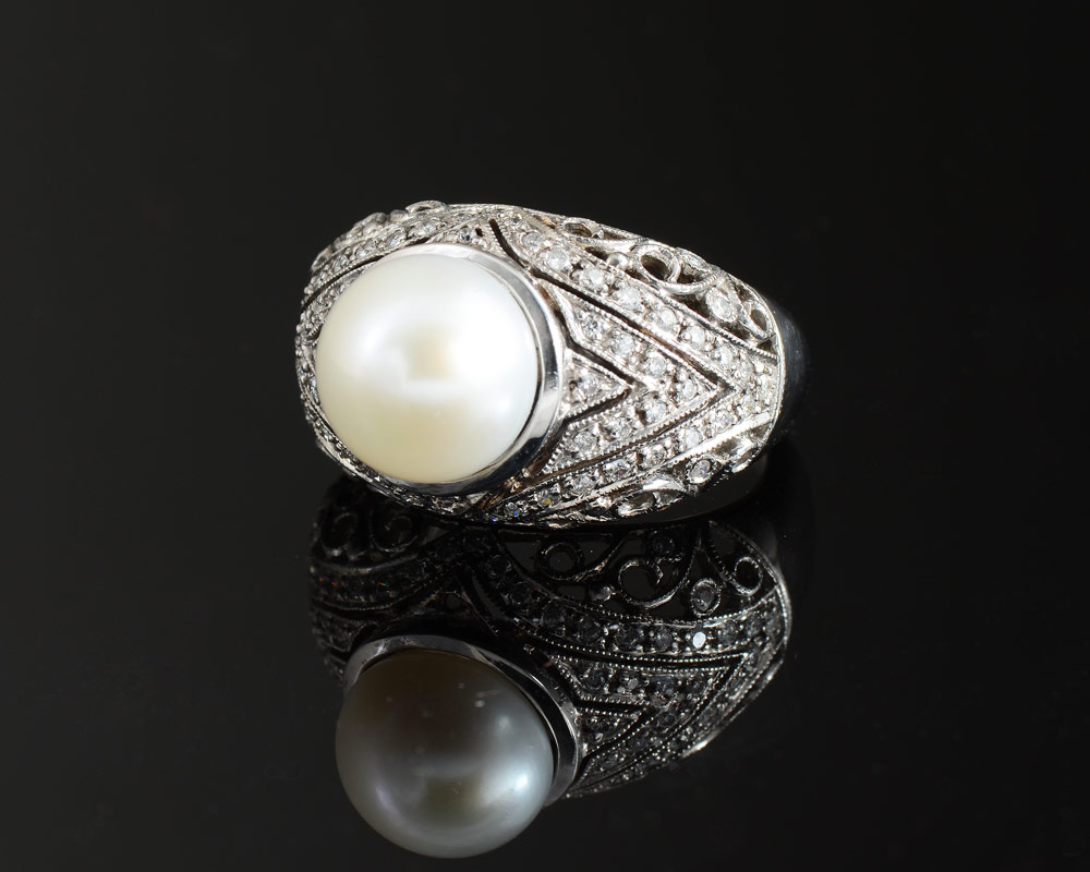 Appraisal: K PEARL DIAMOND RING K white gold ring contains one