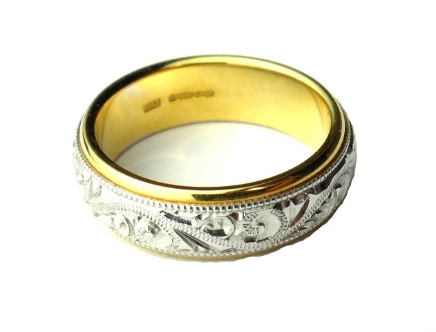 Appraisal: An ct yellow and white gold wedding ring the central