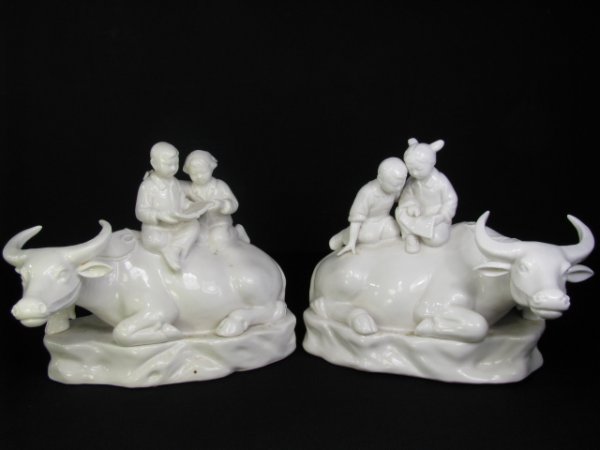 Appraisal: Pair Chinese blanc de chine porcelain ox figurines with children