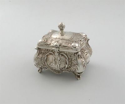 Appraisal: A continental tea caddy of bombe form with embossed decoration