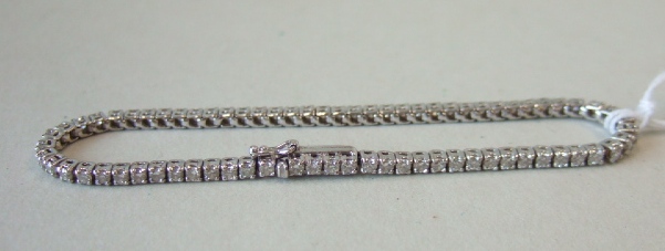 Appraisal: A white gold and diamond set line bracelet mounted with