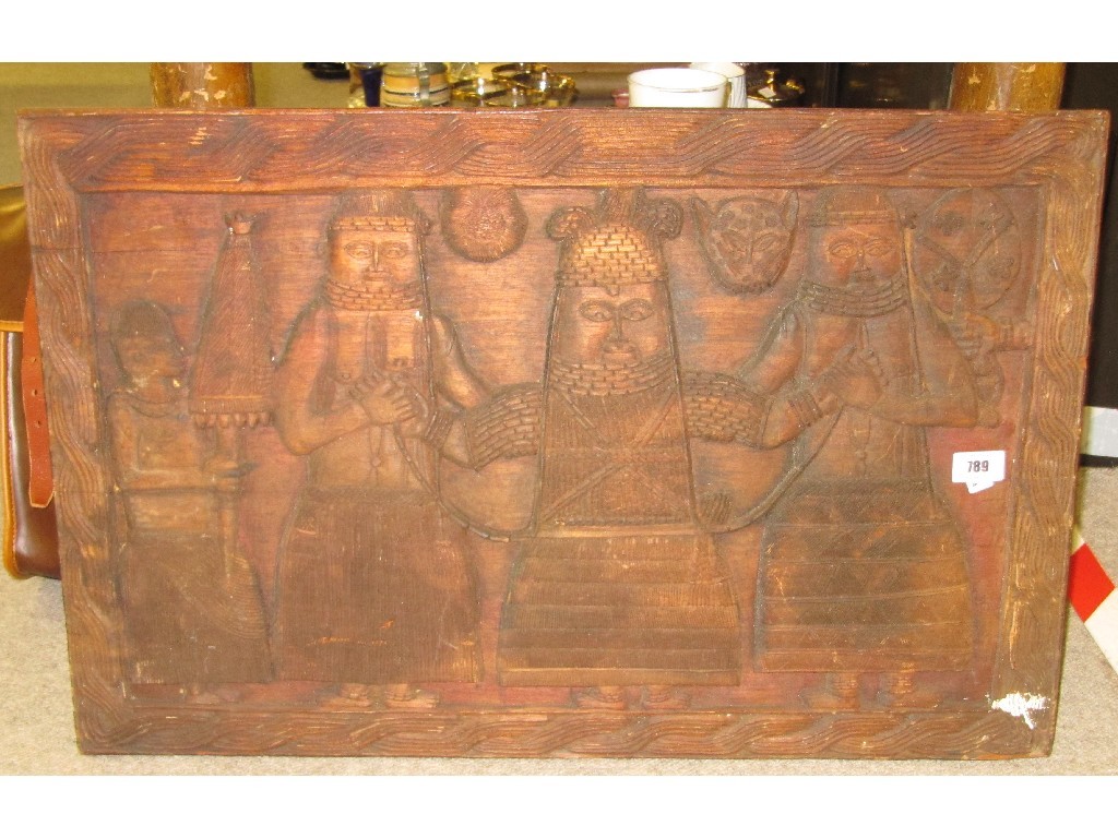 Appraisal: Carved wooden panel with medieval style decoration