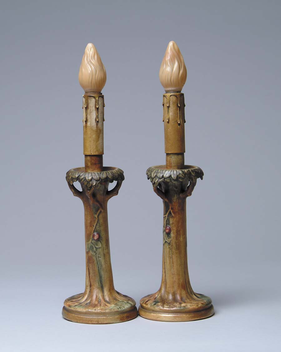 Appraisal: PAIR OF WELLER WOODCRAFT TABLE LAMPS Candle lamps are tree