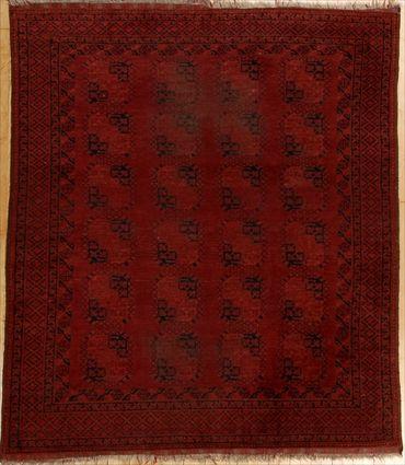 Appraisal: AFGHAN CARPET The wine red field worked with rows of