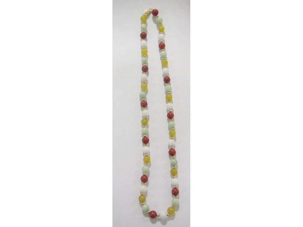 Appraisal: A string of vari coloured jade beads with ct gold