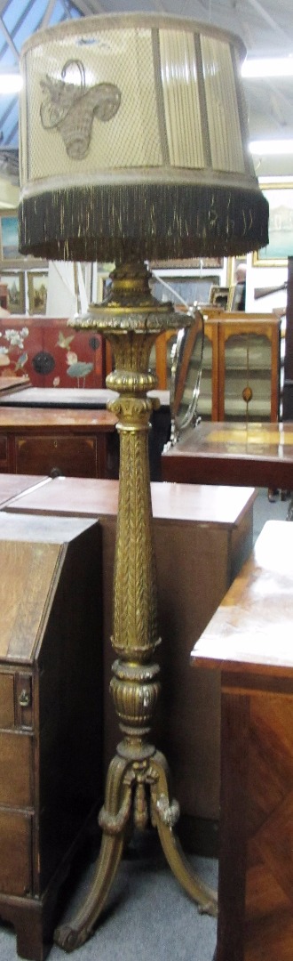 Appraisal: A th century carved giltwood torchere later fitted for electricity