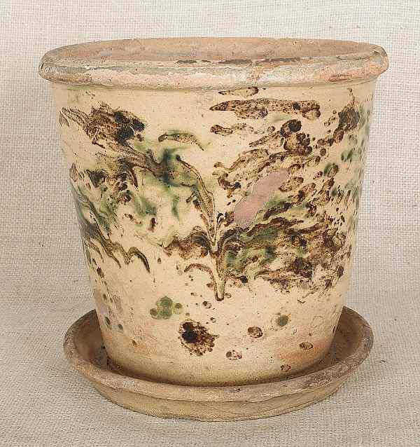 Appraisal: Pennsylvania redware flower pot th c with attached undertray and