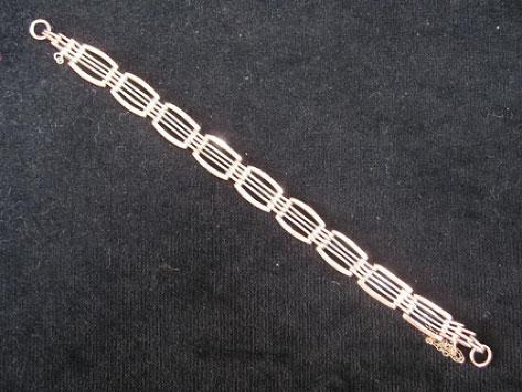 Appraisal: A ROSE AND WHITE GOLD BRACELET each link in the