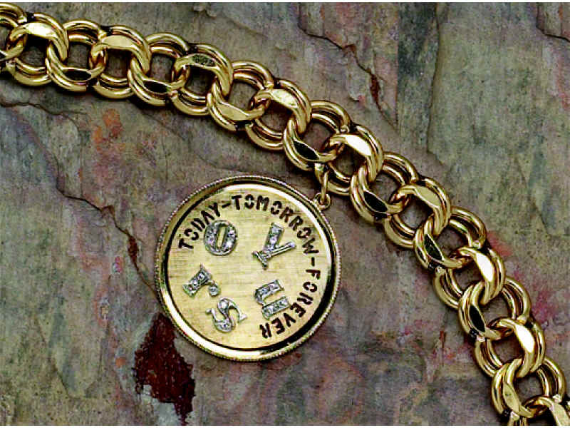 Appraisal: K YELLOW GOLD CHARM BRACELET With double link design and