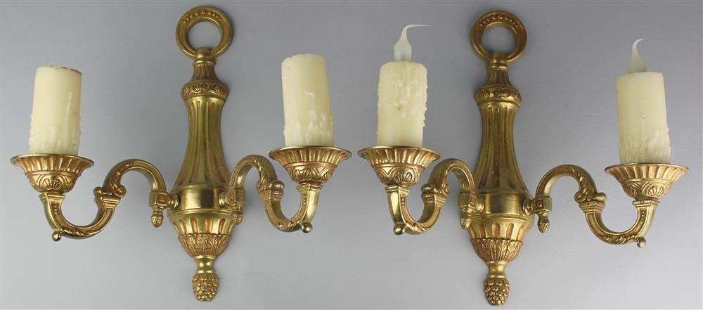 Appraisal: TWO PAIRS OF NEOCLASSICAL STYLE BRASS TWO-LIGHT SCONCES one with