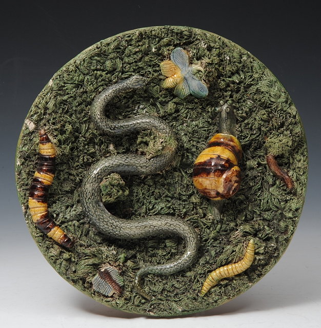 Appraisal: A PORTUGUESE PALISSY STYLE CHARGER the green moss ground applied