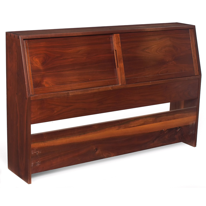 Appraisal: George Nakashima full-size headboard walnut two sliding doors conceal a