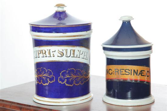 Appraisal: TWO CERAMIC DRUGGIST JARS A lidded cobalt blue jar with