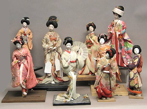 Appraisal: Nine Japanese dolls Taisho Showa period Each an isho-ningyo fashion