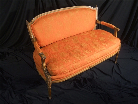 Appraisal: LOUIS XVI STYLE PROVINCIAL SETTEE With coral upholstery h w