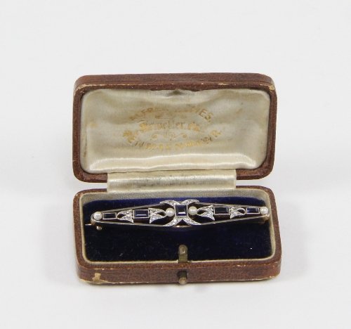 Appraisal: A diamond sapphire and pearl set brooch of openwork form