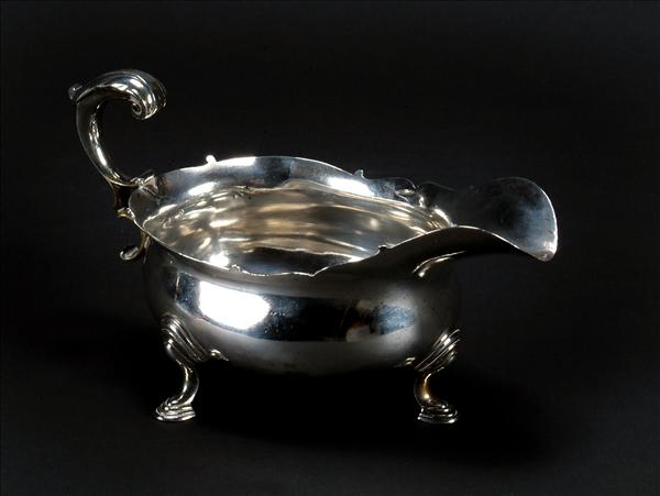 Appraisal: A mid th century oval sauceboat unmarked with a leaf-capped