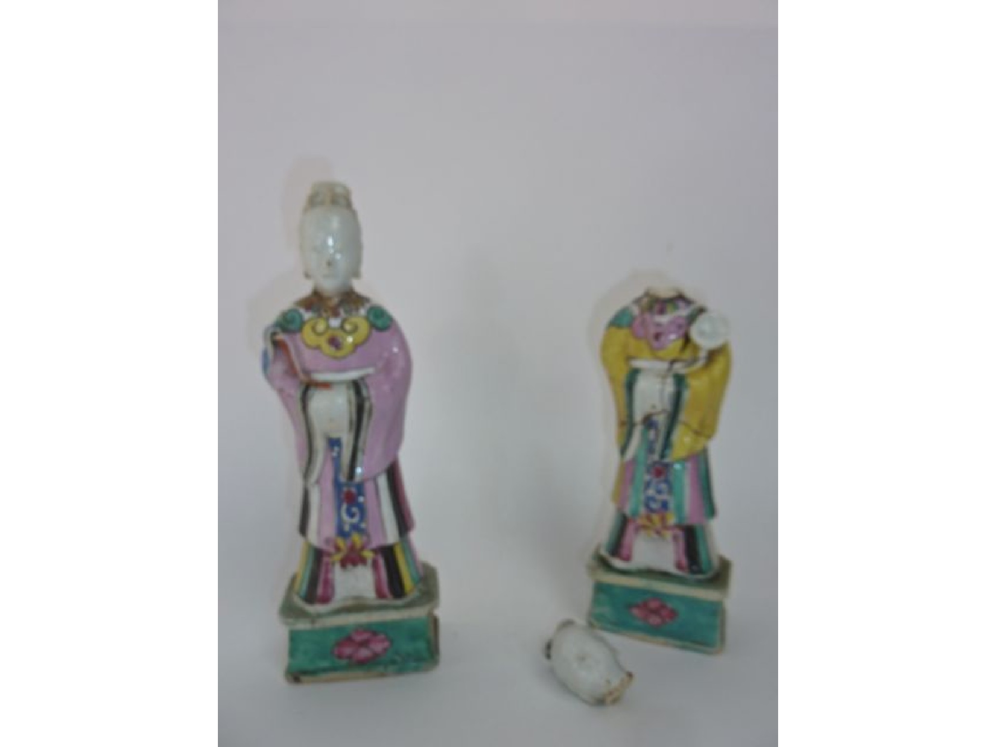 Appraisal: A pair of th century oriental figures of standing female