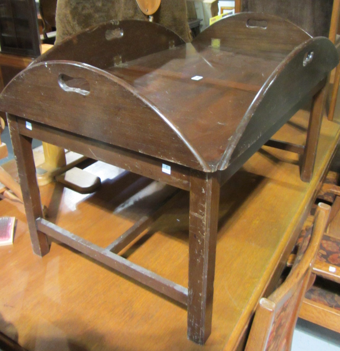 Appraisal: A th century mahogany butler's tray coffee table