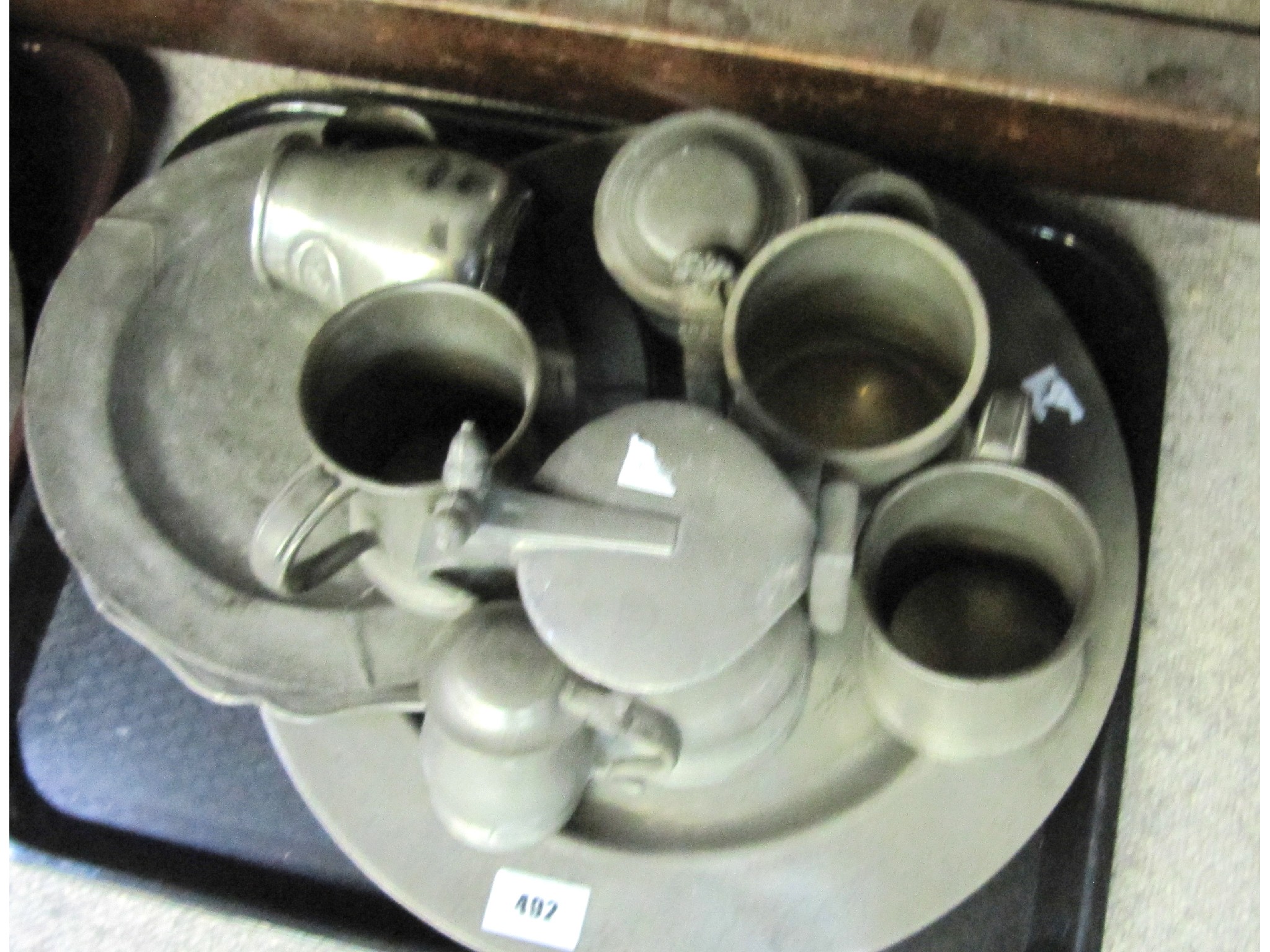 Appraisal: A lot comprising two trays of pewter items - jugs