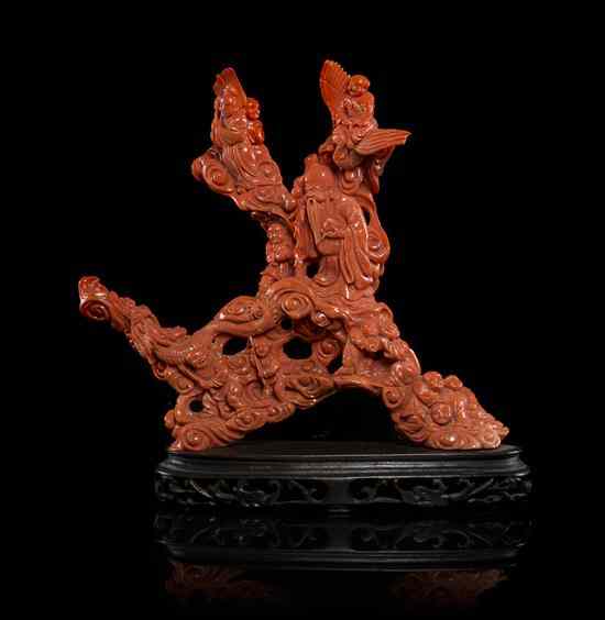 Appraisal: A Chinese Coral Carving of deep orange-red colored coral having