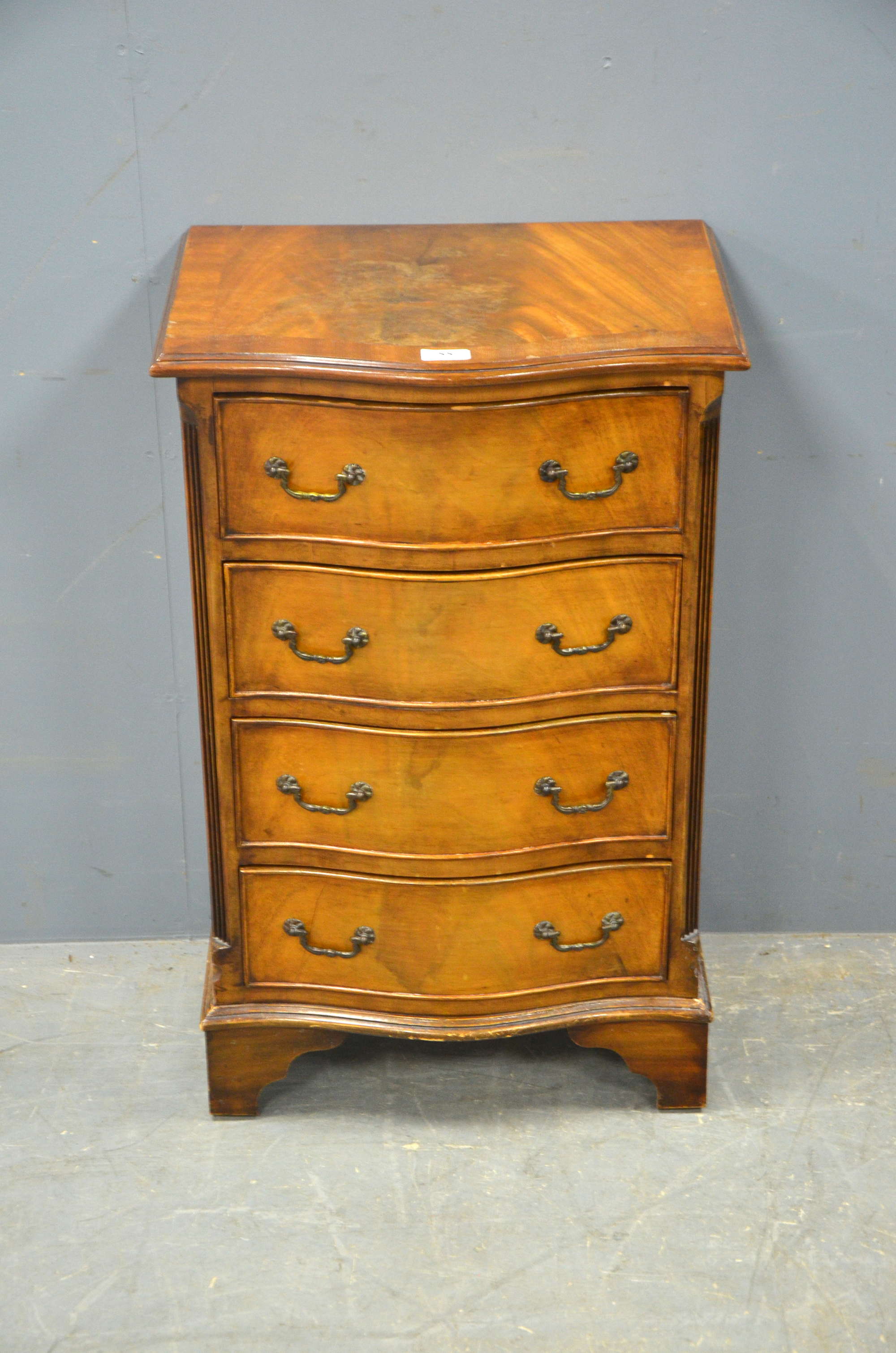 Appraisal: Mahogany card table and a serpentine chest