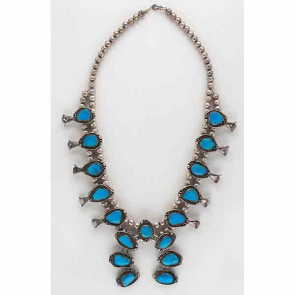 Appraisal: Navajo Squash Blossom Necklace with Turquoise necklace creates bold effect