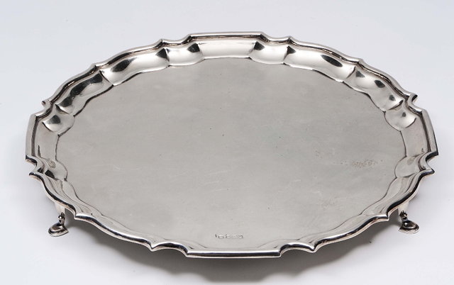 Appraisal: A silver salverof circular form with raised pie-crust border shaped