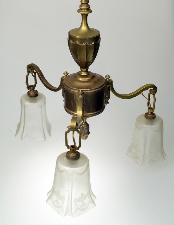 Appraisal: EDWARDIAN BRASS THREE LIGHT CHANDELIER of urn form with downscrolled