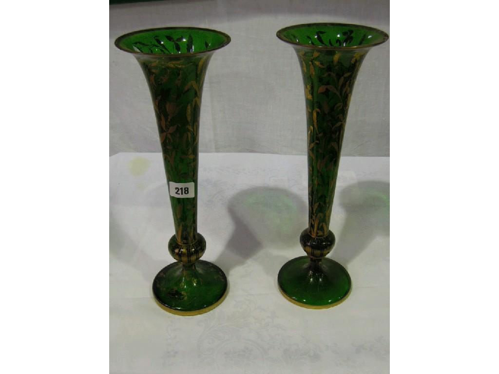 Appraisal: A pair of th century green glass vases of elongated