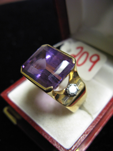 Appraisal: AMETHYST COLORLESS GEMSTONE AND FOURTEEN KARAT GOLD RING centering a