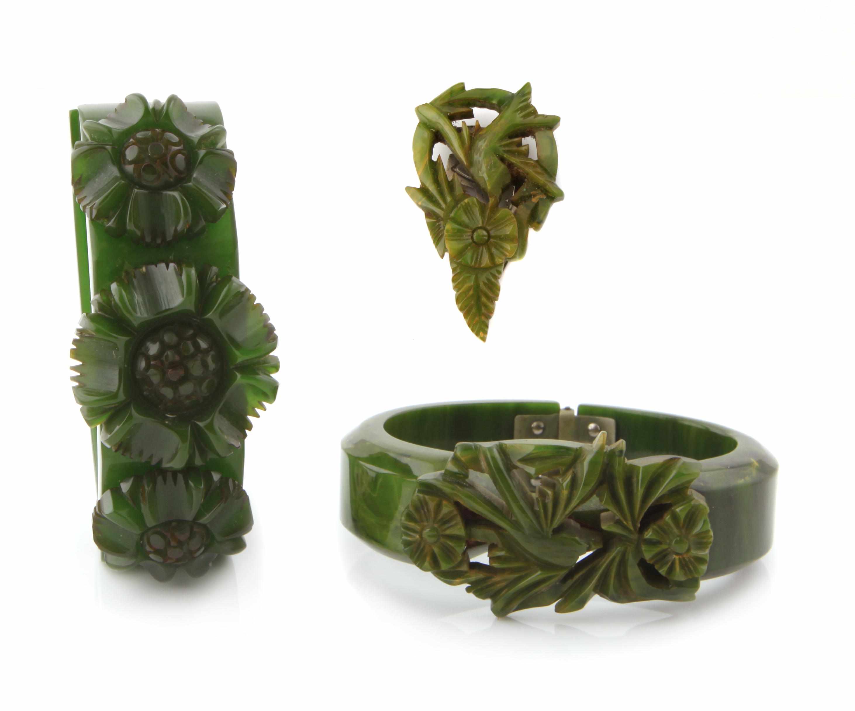 Appraisal: Three carved green Bakelite items two bangle bracelets and a