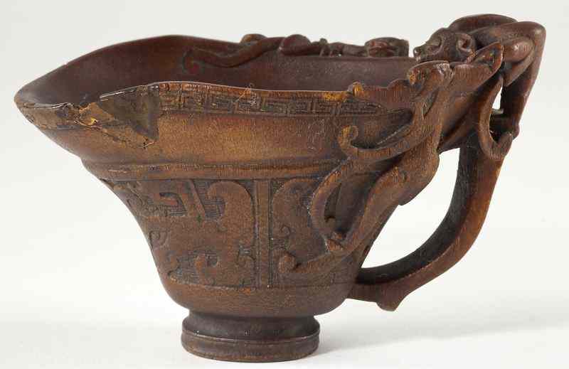 Appraisal: Chinese Rhinoceros Horn Chilong Libation Cup th century or earlier