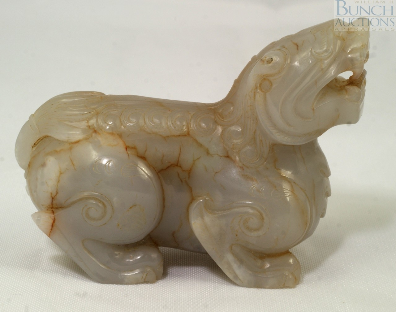 Appraisal: Carved white jade lion long