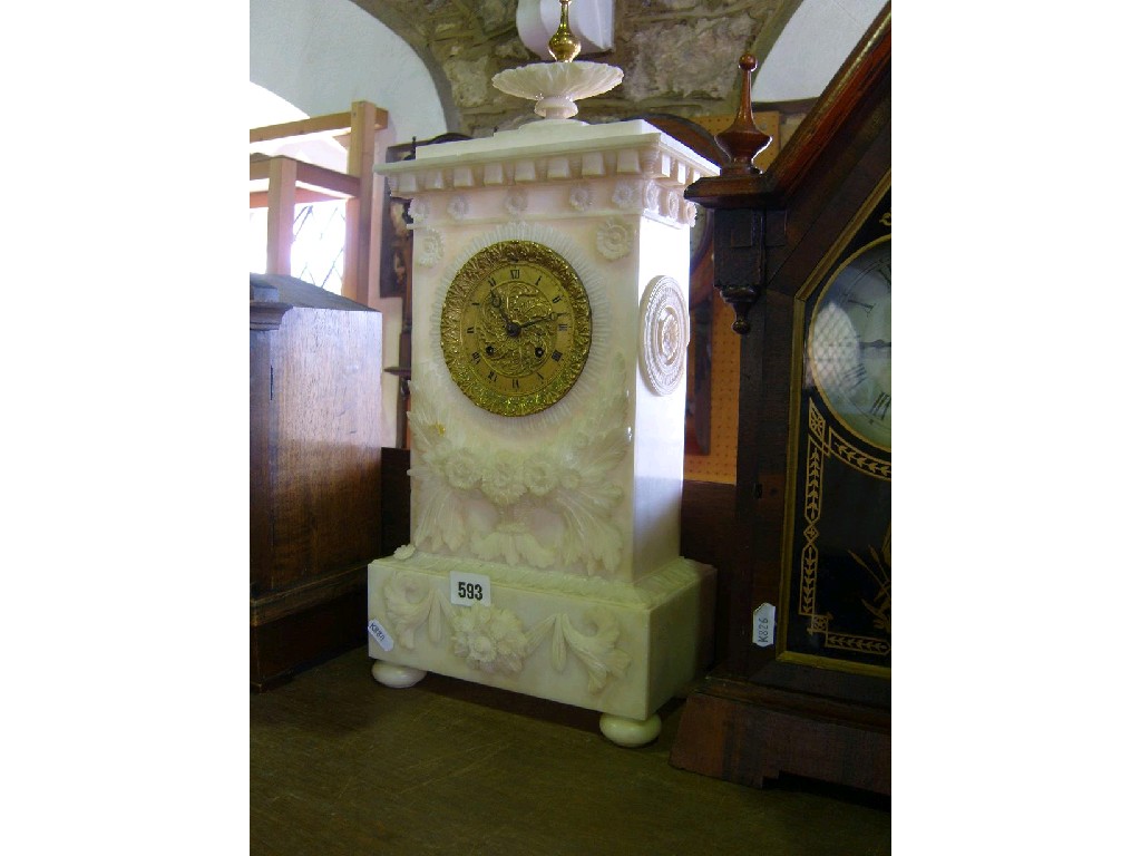 Appraisal: An early th century white alabaster mantle clock with carved