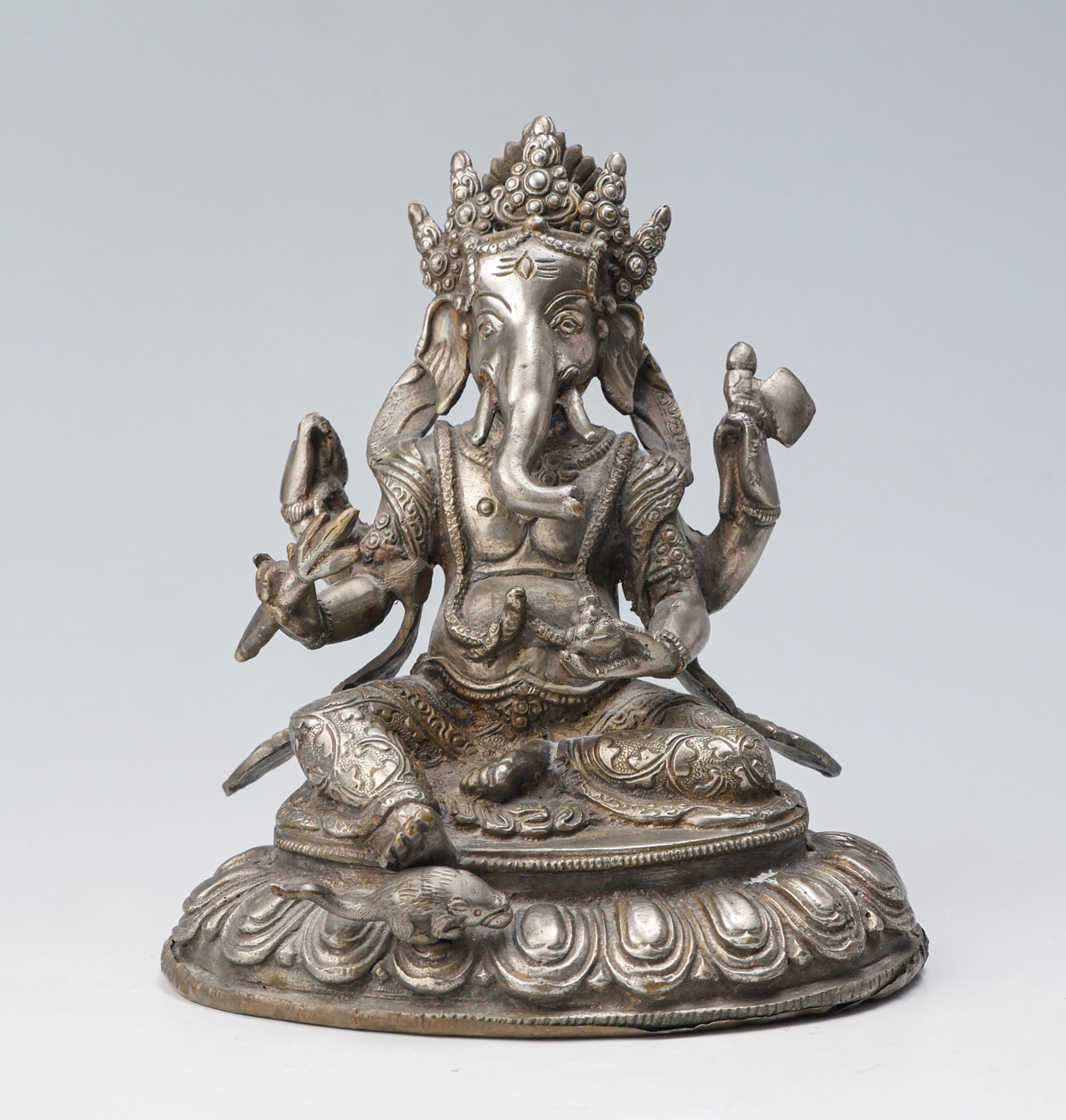 Appraisal: INDIAN HINDU SILVERED BRASS GANESH - Armed silvered brass Ganesh