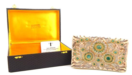 Appraisal: VINTAGE ACCESSORIES Mid- th C gemstone and yellow silk clutch