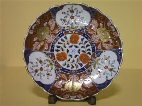 Appraisal: JAPANESE IMARI DISH Centered with a cell-patterned roundel and three