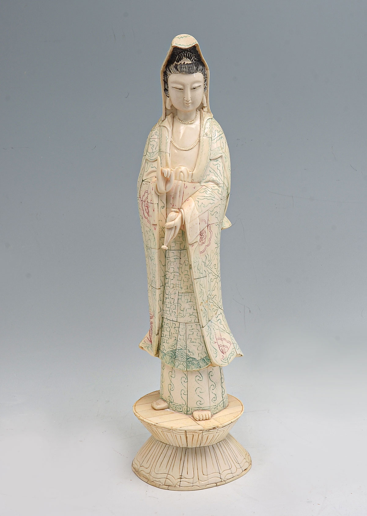 Appraisal: CHINESE BONE CLAD QUAN YIN Bone clad Quan Yin holding