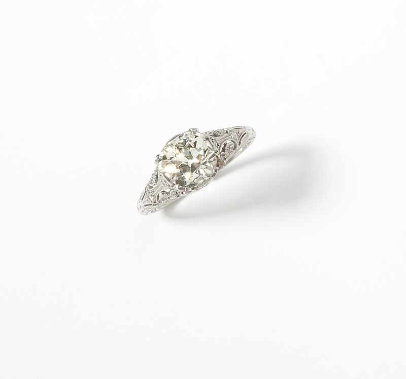 Appraisal: Mounted in platinum centering an old mine-cut diamond weighing approximately