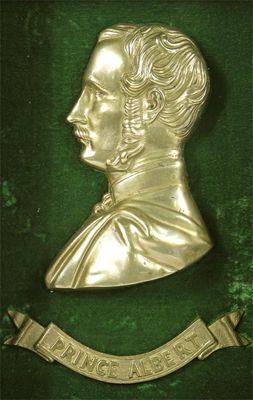 Appraisal: A brass relief profile portrait of Prince Albert set within