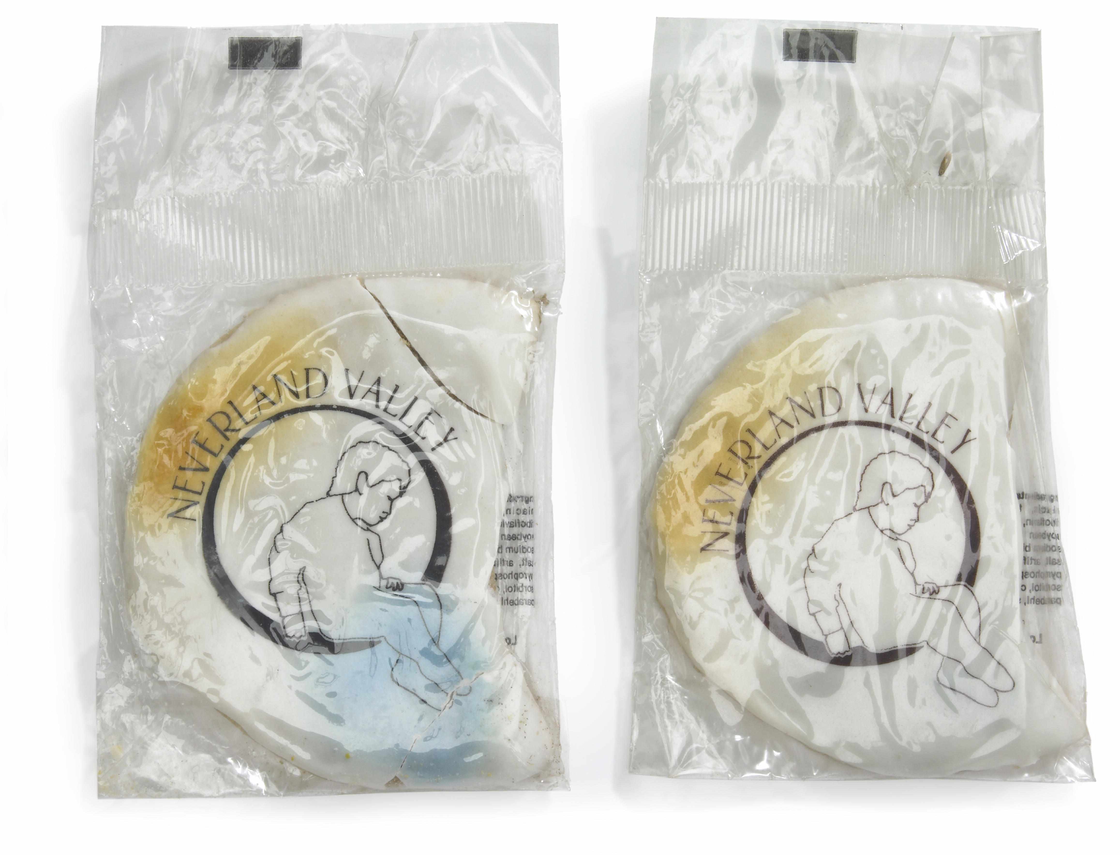 Appraisal: Neverland Valley Ranch sugar cookies Two cookies with white icing