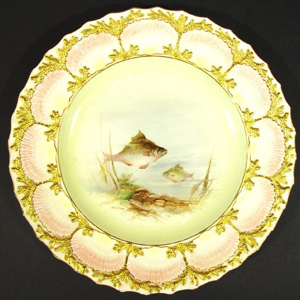 Appraisal: Coalport china plate hand painted with a panel of fish